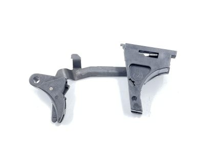 Glock Model 22, 40 cal. pistol parts, trigger, pins, spring, slide stop lever, mag. catch, and barrel stop - Image 10