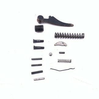 CDM 22 Short pistol parts: mainspring, guide, kicker, pins, screws
