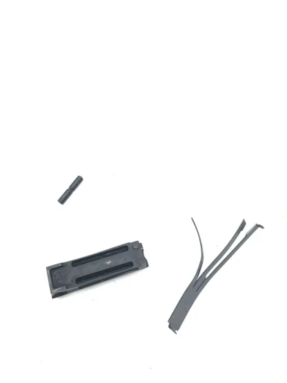 Taurus PT 1911 45 acp, pistol parts, mainspring housing, pin, and spring - Image 3
