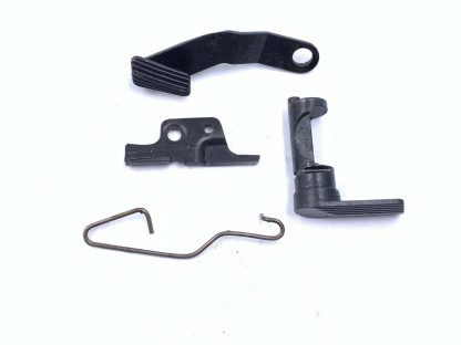 Springfield Armory XDM 40 S&W pistol parts: ejector, slide stop, lever, spring