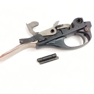 Remington Wingmaster 870 12 gauge shotgun parts: trigger, metal guard, and pin